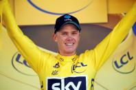 Cycling - Tour de France cycling race - The 184-km (114,5 miles) Stage 8 from Pau to Bagneres-de-Luchon, France - 09/07/2016 - Team Sky rider Chris Froome, new yellow jersey leader, reacts on the podium after winning the stage. REUTERS/Juan Medina