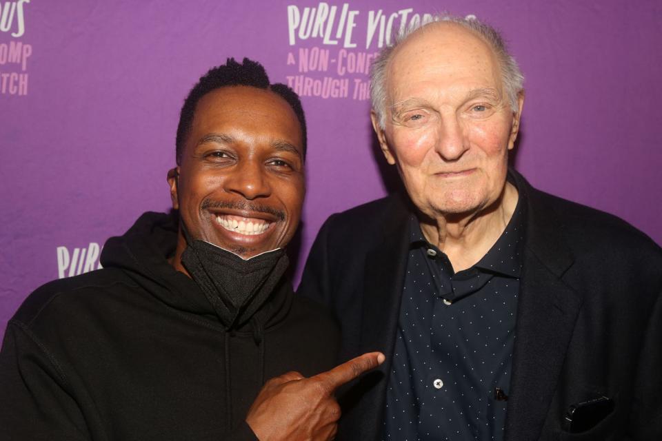 <p>Bruce Glikas/WireImage</p> Leslie Odom Jr. (left) and Alan Alda photographed backstage at 