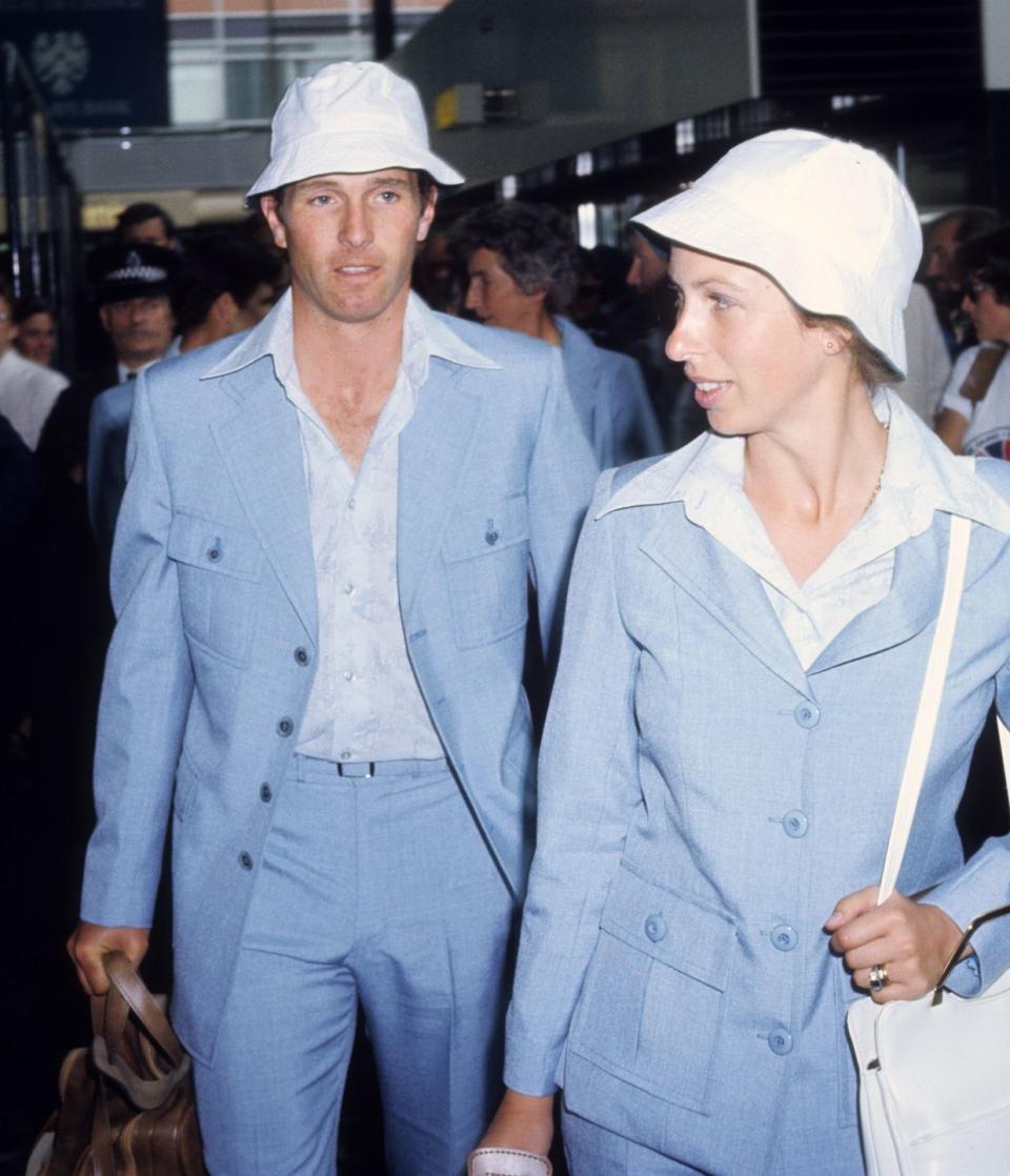 <p>Matching with husband Mark Philips at London's Heathrow Airport.</p>