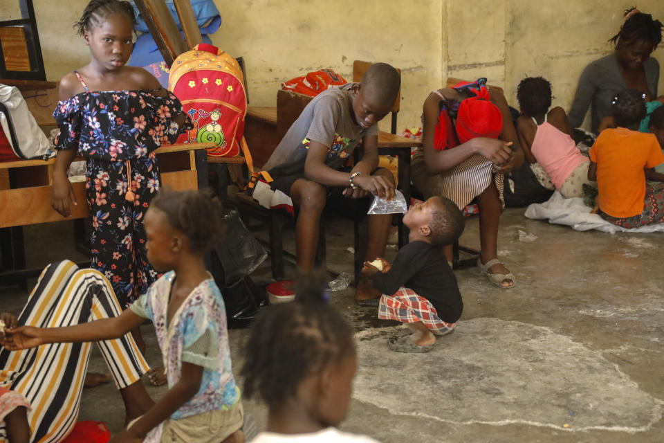 Residents displaced from their homes due to clashes between armed gangs in Pernier, take refugee at a public school serving as a shelter, in the Brothers Road's district of Petion-Ville, Haiti, Wednesday, Jan. 31, 2024. (AP Photo/Odelyn Joseph)