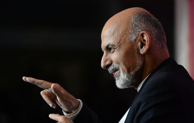 Afghan presidential candidate Ashraf Ghani Ahmadzai gestures during a press conference in Kabul on April 13, 2014