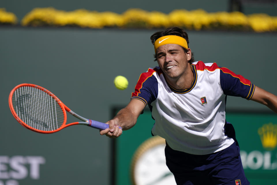 Taylor Fritz, of the United States, returns to Alexander Zverev, of Germany, at the BNP Paribas Open tennis tournament Friday, Oct. 15, 2021, in Indian Wells, Calif. (AP Photo/Mark J. Terrill)