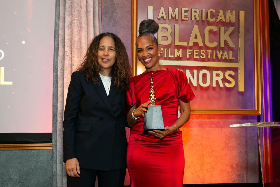 Gina Prince-Bythewood presents the Industry Visionary award to Mara Brock Akil.