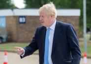 FILE PHOTO: Britain's Prime Minister Boris Johnson visits the Fusion Energy Research Centre at the Fulham Science Centre in Oxfordshire