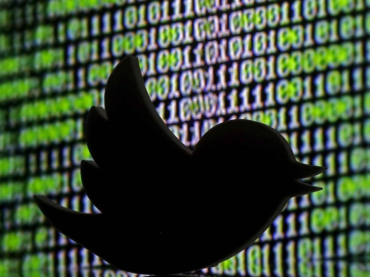 FILE PHOTO: A 3D printed Twitter logo is seen in front of a displayed cyber code in this illustration taken March 22, 2016. REUTERS/Dado Ruvic/Illustration