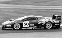 Basing it on the XJ220, Jaguar and TWR built the XJ220C racing version. The racing history of the XJ220 has its ups and downs; a run in the GT class at the 24 Hours of Le Mans in 1993 saw the Jaguar finish two laps ahead of the second-place Porsche, but it ended in a controversial disqualification. The authorities complained that it had run without its standard exhaust system’s catalytic converters.