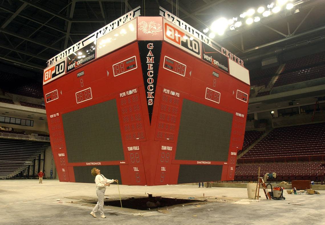 The new scoreboard is slowly lifted at the Carolina Center on Nov. 1, 2002.