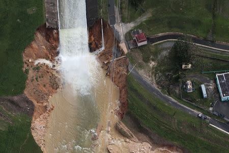 An aerial view shows the damage to the Guajataca dam in the aftermath of Hurricane Maria, in Quebradillas, Puerto Rico September 23, 2017. REUTERS/Alvin Baez