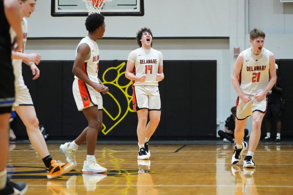 Delaware Hayes' Jeremiah Russell (3), Jake Lowman (14) and Jesse Burris (21) celebrate during their regional semifinal win over Hilliard Bradley.