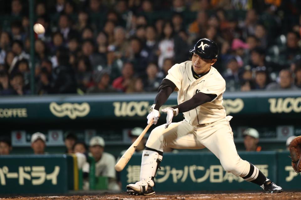 NISHINOMIYA, JAPAN - NOVEMBER 11:  Hayata Itoh #51 of Hanshin Tigers and Yomiuri Giants in action during the friendly match between Hanshin Tigers and Yomiuri Giants at the Hanshin Koshien Stadium on November 11, 2014 in Nishinomiya, Japan.  (Photo by Atsushi Tomura/Getty Images)