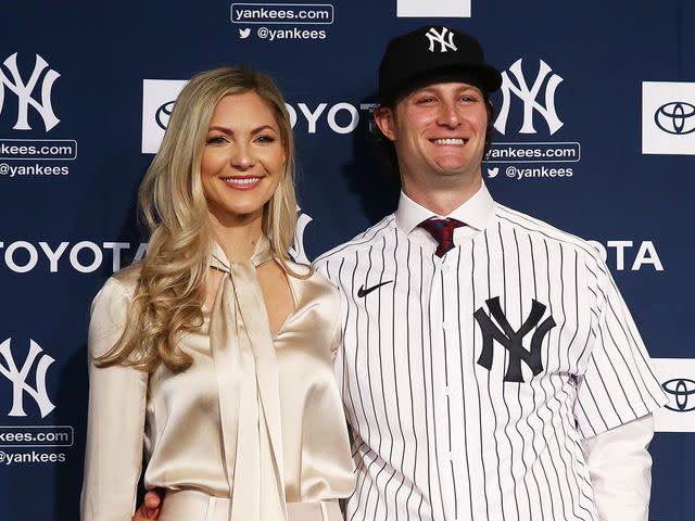 Mike Stobe/Getty Gerrit Cole and his wife Amy Cole pose for a photo at Yankee Stadium during a press conference on December 18, 2019 in New York City.