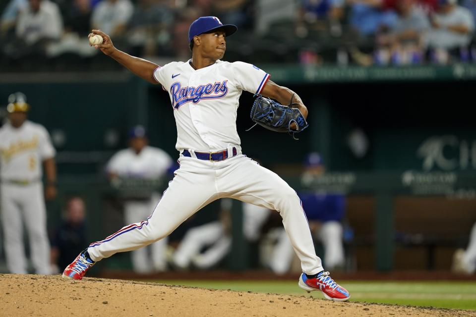 Texas Rangers relief pitcher Jose Leclerc throws to the Oakland Athletics in the ninth inning of a baseball game in Arlington, Texas, Wednesday, Sept. 14, 2022. (AP Photo/Tony Gutierrez)