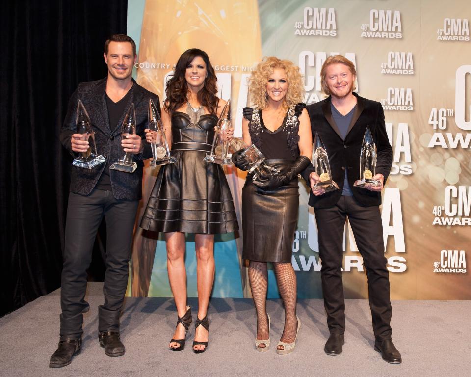 NASHVILLE, TN - NOVEMBER 01: (L-R) Jimi Westbrook, Karen Fairchild, Kimberly Schlapman and Phillip Sweet of Little Big Town pose with their awards at the 46th annual CMA Awards at the Bridgestone Arena on November 1, 2012 in Nashville, Tennessee. (Photo by Erika Goldring/Getty Images)