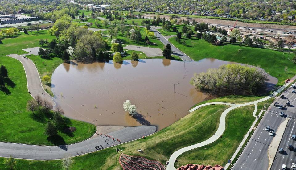 Runoff water flows over the roads and past the pond to a lower collection area in Sugarhouse Park in Salt Lake City on Tuesday, May 2, 2023. | Jeffrey D. Allred, Deseret News