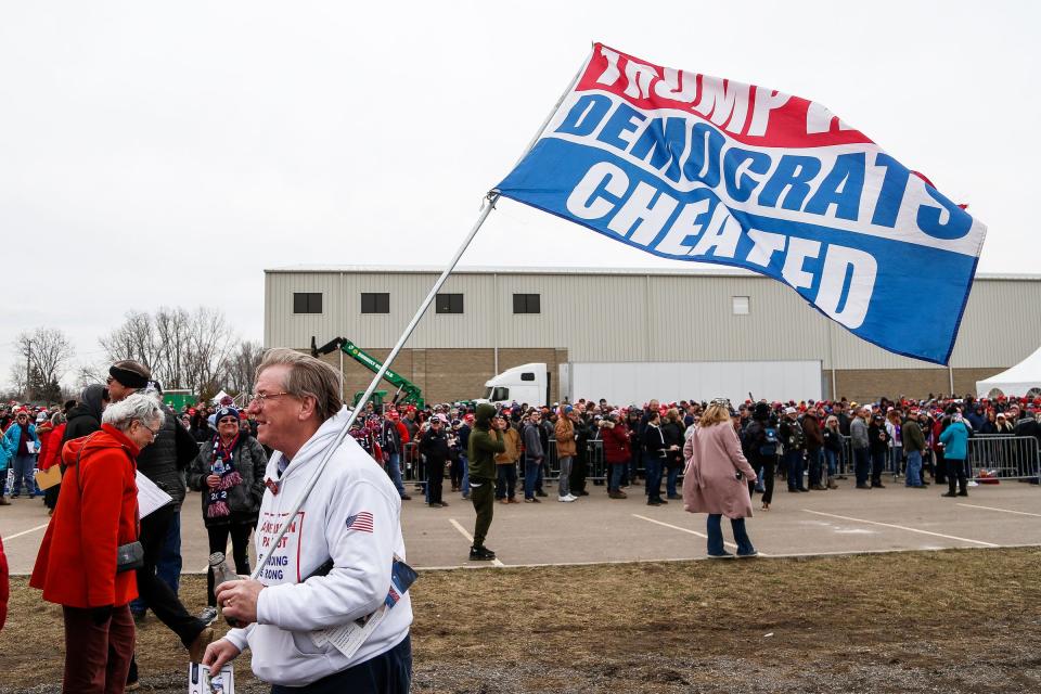 Supporters wait in line before a Save America rally at the Michigan Stars Sports Center in Washington Township on April 2, 2022.