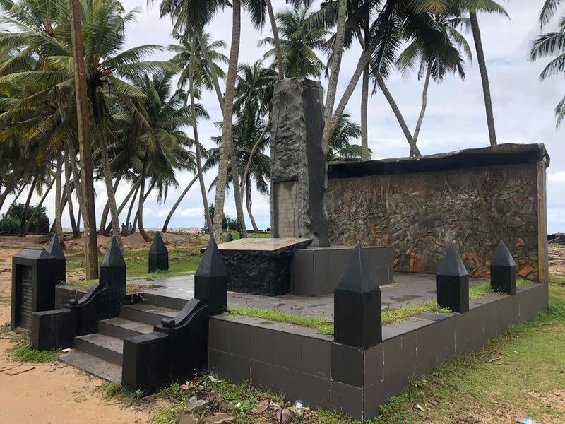 A memorial for those who died in the 2004 Boxing Day tsunami is seen near a tsunami-hit village, in Seenigama, Sri Lanka
