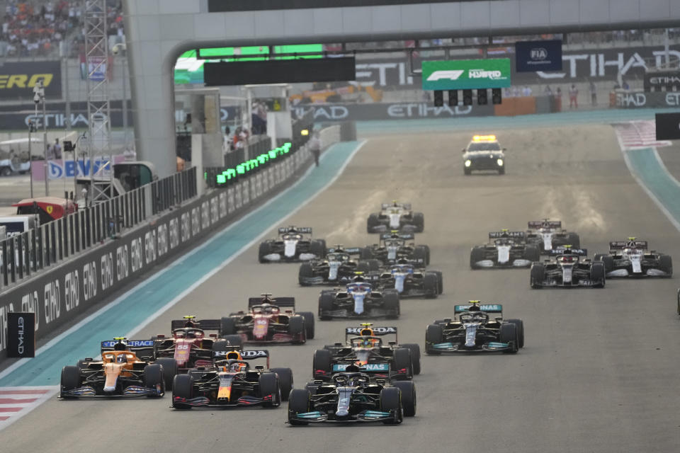 Mercedes driver Lewis Hamilton of Britain leads at the start the Formula One Abu Dhabi Grand Prix in Abu Dhabi, United Arab Emirates, Sunday, Dec. 12. 2021. (AP Photo/Hassan Ammar)