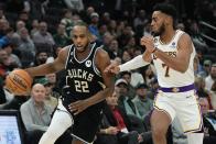 Milwaukee Bucks' Khris Middleton drives past Los Angeles Lakers' Troy Brown Jr. during the first half of an NBA basketball game Friday, Dec. 2, 2022, in Milwaukee. (AP Photo/Morry Gash)