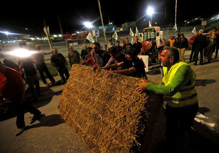 Farmers of FNSEA, France's largest farmers' union, block the Total biodiesel refinery at La Mede near Fos-sur-Mer, France June 10, 2018. REUTERS/Jean-Paul Pelissier