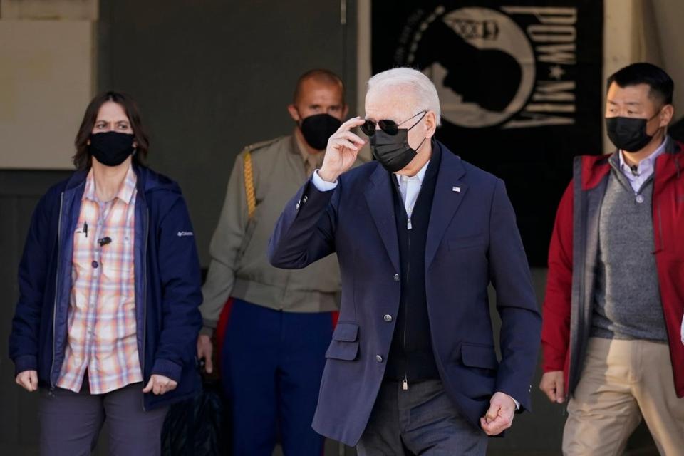 US President Joe Biden walks to greet members of the United States Coast Guard (AP)