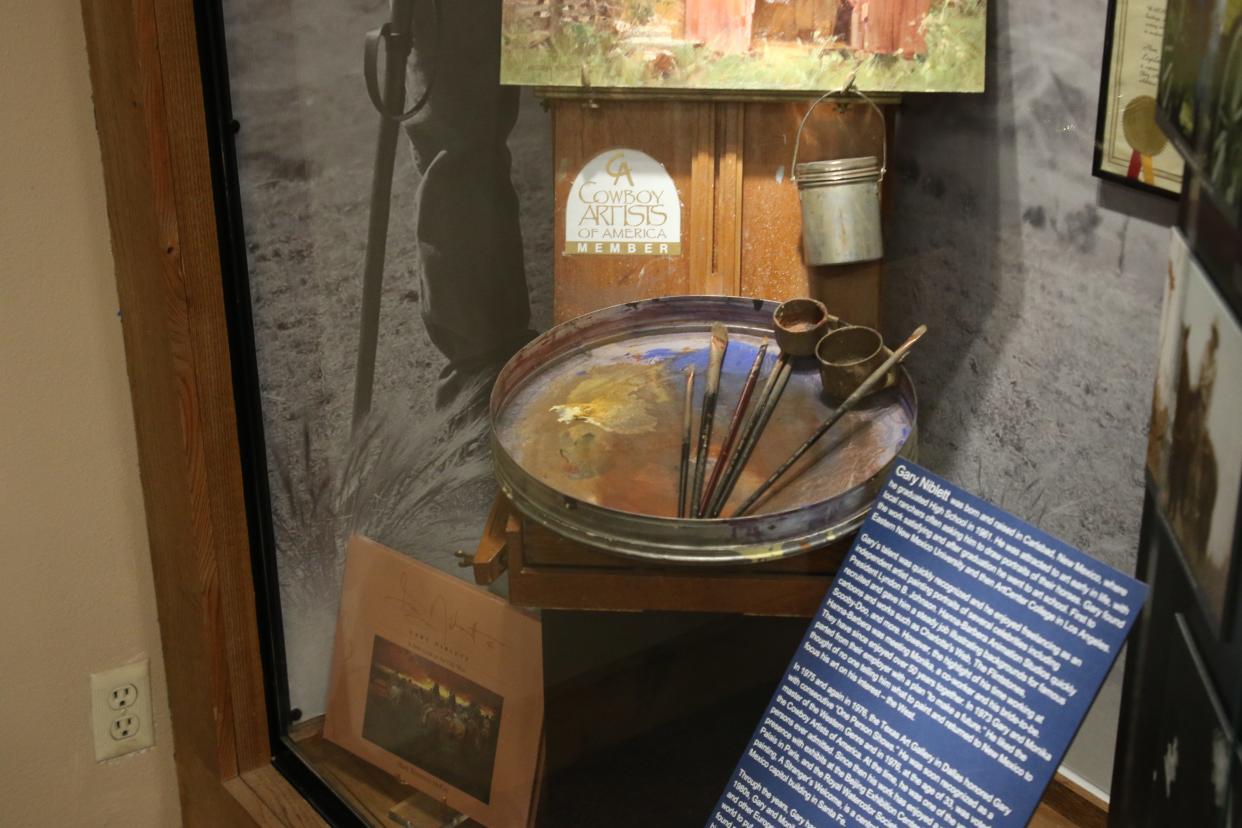 An easel belonging to artist Gary Niblett sits in a display case at the Carlsbad Hall of Fame.