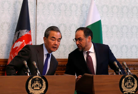 Afghanistan's Foreign Minister Salahuddin Rabbani chats with China's Foreign Minister Wang Yi, during a news conference in Kabul, Afghanistan December 15, 2018.REUTERS/Mohammad Ismail