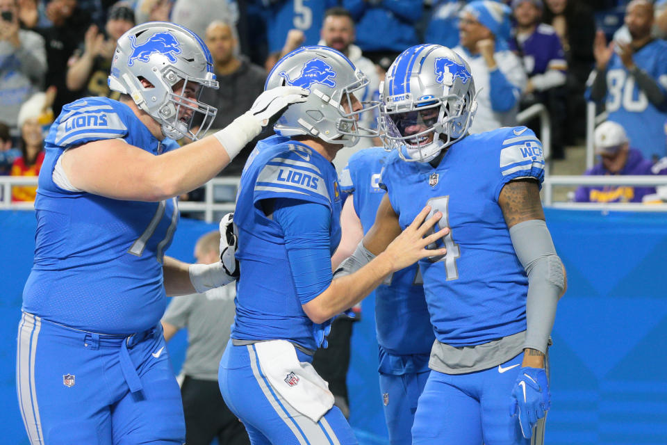 Detroit Lions wide receiver DJ Chark (4) celebrates his touchdow with quarterback Jared Goff (16) during the first half of an NFL football game against the Minnesota Vikings in Detroit, Michigan USA, on Sunday, December 11, 2022 (Photo by Jorge Lemus/NurPhoto via Getty Images)