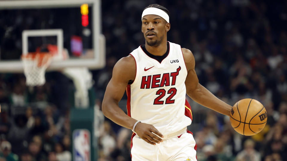 Miami Heat forward Jimmy Butler (22) dribbles the ball up the court against the Milwaukee Bucks during the first half of Game 5 in a first-round of an NBA basketball playoff series Wednesday, April 26, 2023, in Milwaukee. (AP Photo/Jeffrey Phelps)