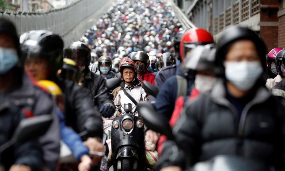 Commuters in Taipei wear face masks. Taiwan has been one of the most successful countries in controlling the coronavirus epidemic.