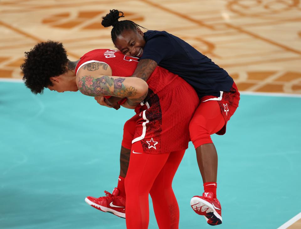 PARIS, FRANCE - AUGUST 11: Jewell Loyd #4 of Team United States hugs Brittney Griner #15 of Team United States after her team's victory against Team France during the Women's Gold Medal game between Team France and Team United States on day sixteen of the Olympic Games Paris 2024 at Bercy Arena on August 11, 2024 in Paris, France. (Photo by Sarah Stier/Getty Images) ORG XMIT: 776138675 ORIG FILE ID: 2166336459