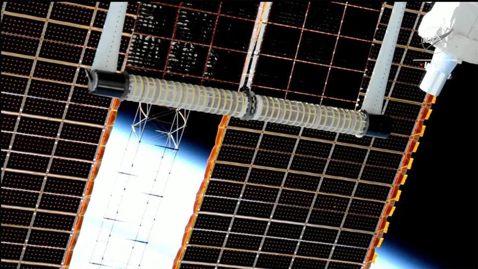 The new ISS Roll-Out Solar Array blanket unrolls on its own after installation, stretching out 60 feet to add about 20 kilowatts of electricity to the lab's power grid. / Credit: NASA