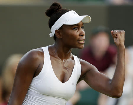 Venus Williams of the U.S.A. celebrates after winning her match against Yulia Putintseva of Kazakhstan at the Wimbledon Tennis Championships in London, July 1, 2015. REUTERS/Henry Browne