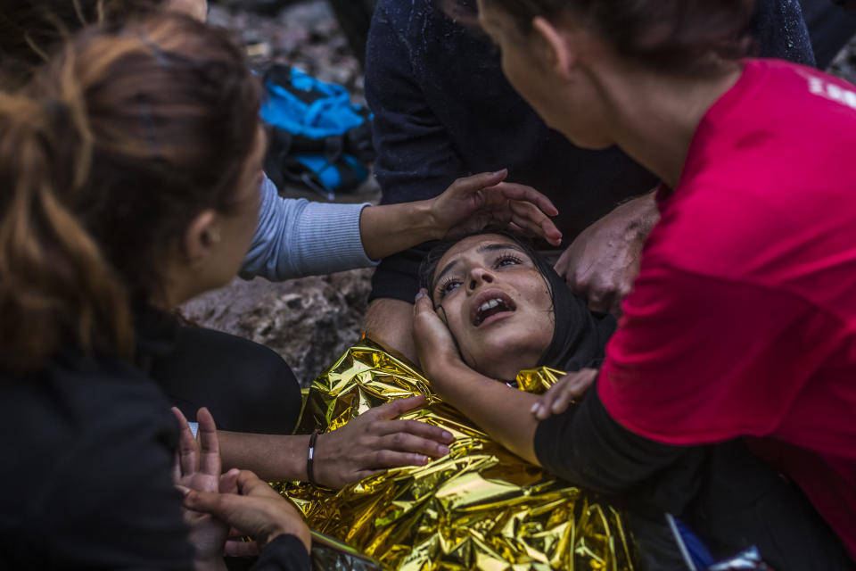 A woman reacts as she arrived with other refugees on the shores of the Greek island of Lesbos after crossing the Aegean sea from Turkey on a inflatable boat on October 1, 2015 near village of Skala Sikaminias, Greece.&nbsp;