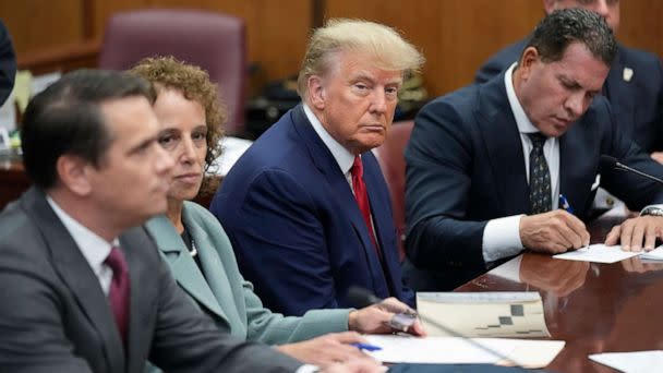 PHOTO: Former President Donald Trump sits at the defense table with his defense team in a Manhattan court, April 4, 2023, in New York. (Seth Wenig/AP)