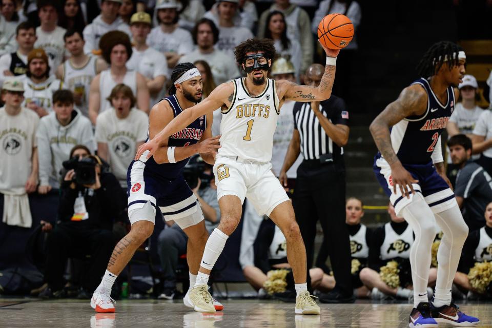 Feb 10, 2024; Boulder, Colorado, USA; Colorado Buffaloes guard J'Vonne Hadley (1) controls the ball against Arizona Wildcats guard Kylan Boswell (4) in the first half at CU Events Center.