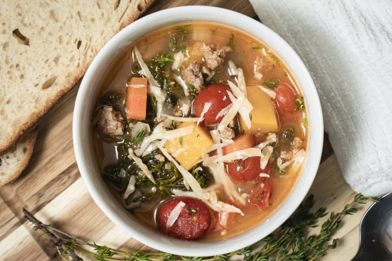 Turkey soup in a bow with bread.