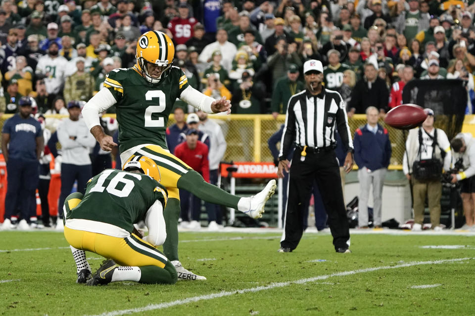 Green Bay Packers place kicker Mason Crosby (2) kicks a 31-yard field goal during overtime in an NFL football game against the New England Patriots, Sunday, Oct. 2, 2022, in Green Bay, Wis. The Packers won 27-24. (AP Photo/Morry Gash)