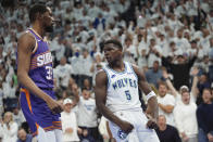 Minnesota Timberwolves guard Anthony Edwards celebrates after a dunk during the second half of Game 1 of an NBA basketball first-round playoff series against the Phoenix Suns, Saturday, April 20, 2024, in Minneapolis. (AP Photo/Abbie Parr)