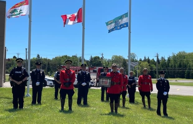 Police, firefighters and paramedics on P.E.I. pay respect to fallen RCMP officer Shelby Patton on Sunday. (Tony Davis/CBC - image credit)