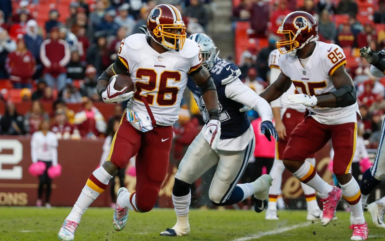 Washington Redskins running back Adrian Peterson in action in 2018 - AP