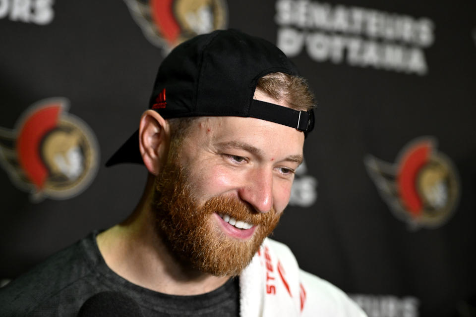 Ottawa Senators' Claude Giroux speaks to reporters during the team's NHL hockey training camp in Ottawa, Thursday, Sept. 22, 2022. (Justin Tang/The Canadian Press via AP)