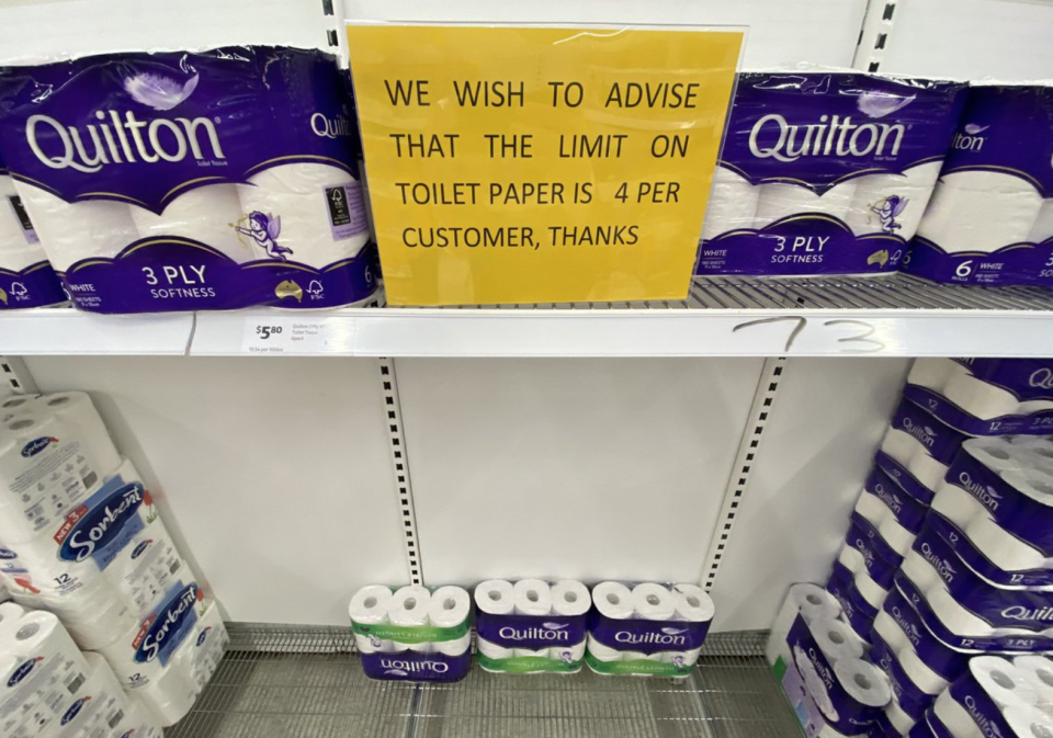 A picture taken in a Coles shows a sign informing customers they can only buy four packs of toilet paper. Source: 7 News.