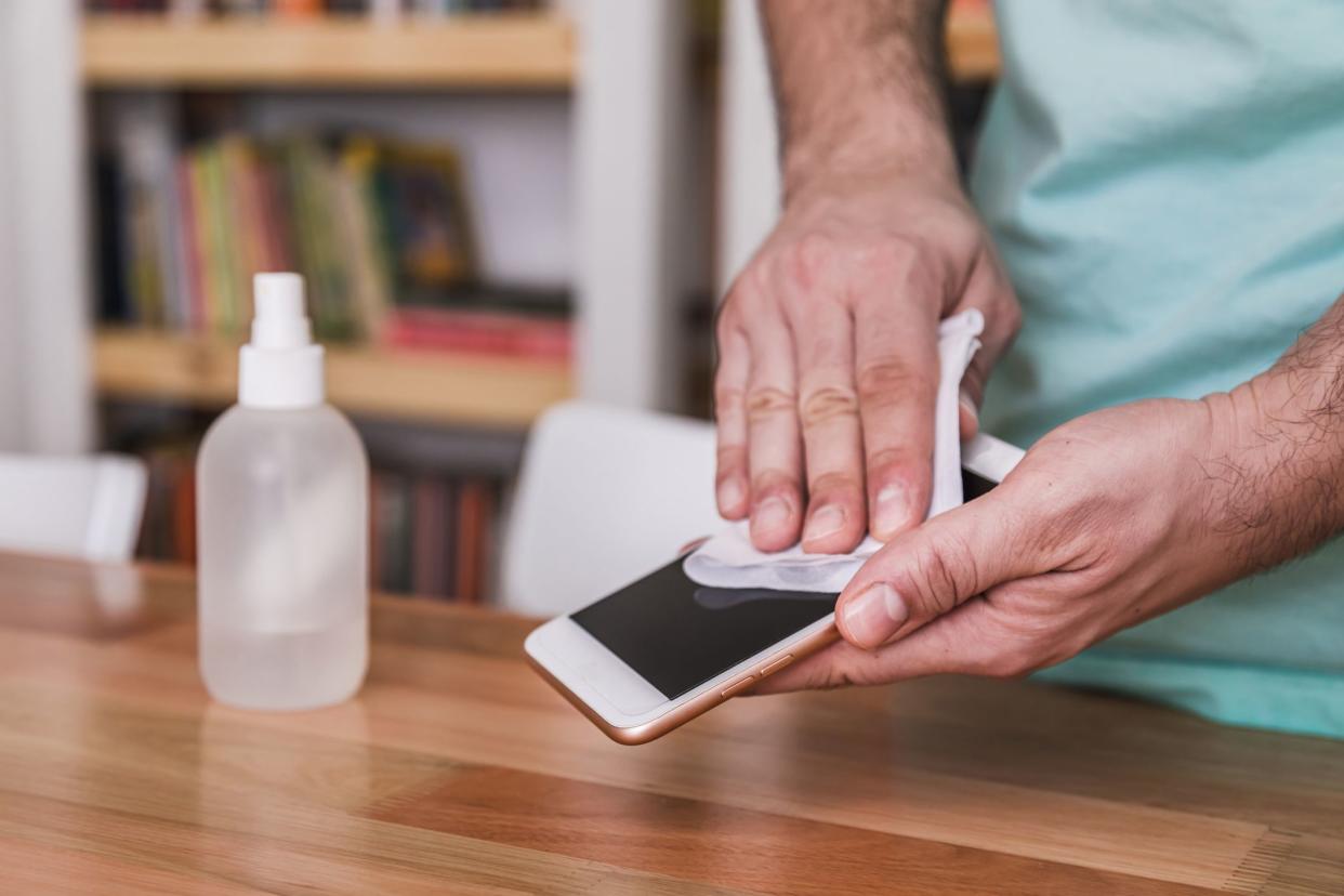 Cleaning the cell phone with disinfecting wipes, since it has a lot of contact with our body and needs to be clean and disinfected.