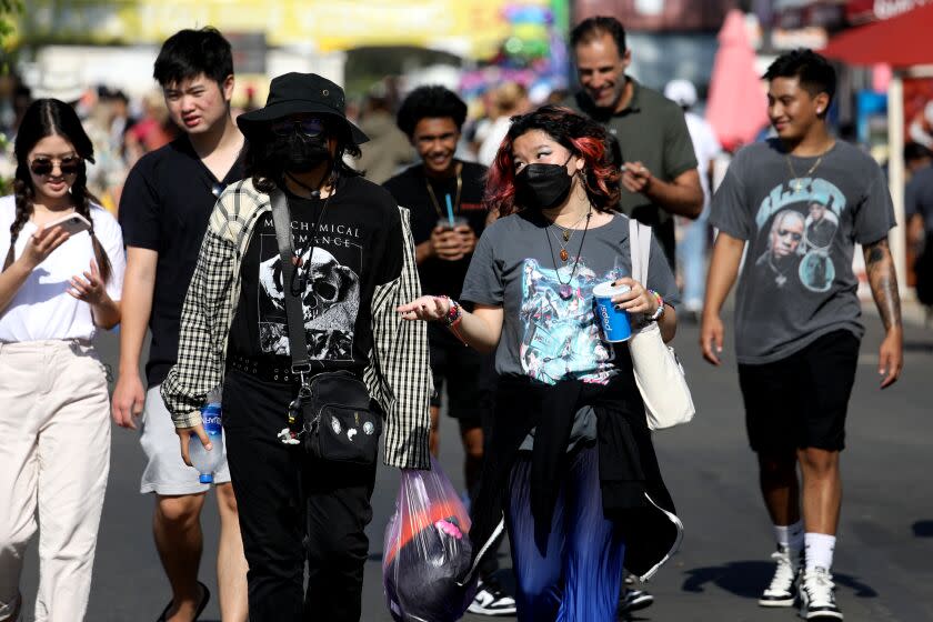 COSTA MESA, CA - JULY 15: Guests hit the midway on opening day at the Orange County Fair at the Costa Mesa fairgrounds on Friday, July 15, 2022 in Costa Mesa, CA. (Gary Coronado / Los Angeles Times)