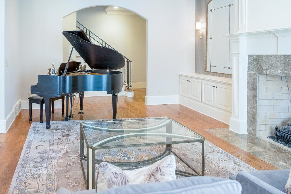 The family's baby grand piano holds court in a room of its own.