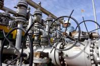 FILE PHOTO: A worker checks the valves at Al-Sheiba oil refinery in Basra, Iraq, January 26, 2016. REUTERS/Essam Al-Sudani/File Photo