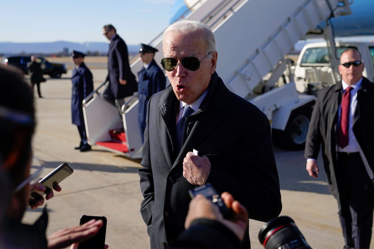 President Joe Biden speaks with members of the press on Saturday (AP)