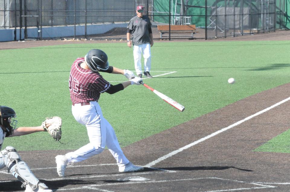 Salina Central's Gunnar Gross (33) swings at a pitch during Monday's doubleheader against Eisenhower at Dean Evans Stadium.