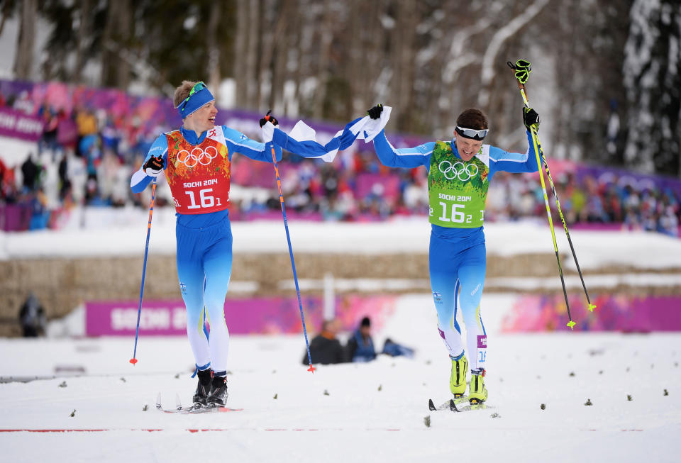 SOCHI, RUSSIA - FEBRUARY 19:  Sami Jauhojaervi (R) of Finland celebrates with team mate Iivo Niskanen of Finland after they won the gold medal in the Men's Team Sprint Classic Final during day 12 of the 2014 Sochi Winter Olympics at Laura Cross-country Ski & Biathlon Center on February 19, 2014 in Sochi, Russia.  (Photo by Harry How/Getty Images)