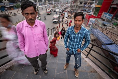 Bhim Bahadur Khadka, 40, left, is owed QR6,700 (£1,424) while Bibek Chaudhary, 27, right, is owed QR7,020 (£1,492)  - Credit: Simon Townsley/The Telegraph